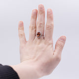 Anello vintage in oro 18K con granato arancione (6.60ct ca.) e diamanti (0.70ctw ca.), anni '60