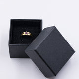 Anello vintage in oro 18k con rubini taglio carrè, anni '70