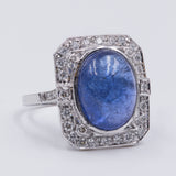 Bague en or blanc 18 carats avec tanzanite cabochon (7 ct) et diamants (0,45 ct)