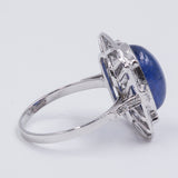 Bague en or blanc 18 carats avec tanzanite cabochon (7 ct) et diamants (0,45 ct)