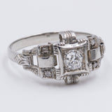 Anello Art Decò in platino con diamante taglio vecchia miniera ( 0,20ct) e rosette, anni '30