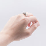 Anello Art Decò in platino con diamante taglio vecchia miniera ( 0,20ct) e rosette, anni '30