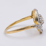 Anello "Tourbillon" in oro giallo 18K e platino con diamante centrale (0.40ct ca.) e rosette laterali, anni '20