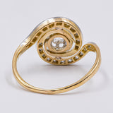 Anello "Tourbillon" in oro giallo 18K e platino con diamante centrale (0.40ct ca.) e rosette laterali, anni '20