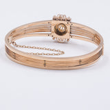 BRACCIALE RIGIDO ANTICO IN ORO 14K CON PERLA CENTRALE, FINE '800