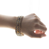 Bracciale semirigido in oro 18K con quarzi citrini, anni '50