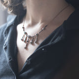 Collier Liberty in oro 14K e argento con diamanti e smeraldi, anni '20