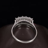 Anello antico in platino con diamanti taglio smeraldo, anni '30