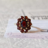 Vintage 8K gold daisy ring with garnets, 1950s / 1960s