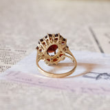 Vintage 8K gold daisy ring with garnets, 1950s / 1960s