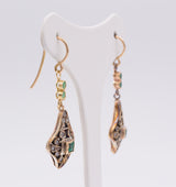 Liberty earrings in gold and silver with emeralds and diamond rosettes.