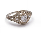 Anello antico in oro bianco con diamante centrale e piccole rosette , anni 30