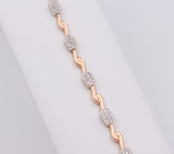 Bracciale in oro giallo e bianco con diamanti a pavé