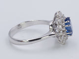 Anello vintage in oro bianco con zaffiro centrale e diamanti