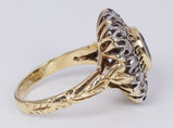 Anello vintage in oro e argento con zaffiro centrale e rosette di diamante, anni 40