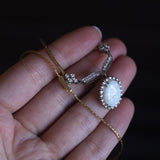Vintage necklace in 18K gold with opal (3.50ct approx.) And diamonds (0.36ctw approx.), 60s / 70s