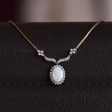 Vintage necklace in 18K gold with opal (3.50ct approx.) And diamonds (0.36ctw approx.), 60s / 70s