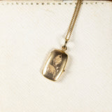 Pendente portafoto in oro 18K con calla incisa, primi del '900 - Antichità Galliera