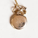 Ciondolo portafoto antico in oro 18K con rubini, anni '40