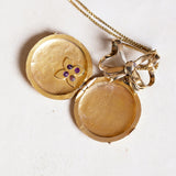 Ciondolo portafoto antico in oro 18K con rubini, anni '40
