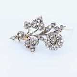 Broche Liberty en or 18 carats et argent avec rosaces de diamants