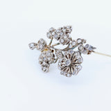 Broche Liberty en or 18 carats et argent avec rosaces de diamants
