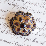 Spilla vintage in oro 18K con granati e smalti blu, anni '50
