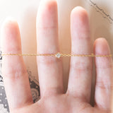 Braccialetto vintage in oro 18K con punto luce (0.05ct ca.), anni ‘70/‘80