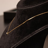 Collana vintage in oro 14K con punto luce di 0.10ct ca., anni ‘70/‘80