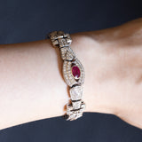 Bracciale semirigido vintage in oro bianco 18K con rubino naturale (0.90ct ca.) e diamanti (6.30ctw ca.), anni ‘60