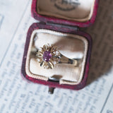 Anello a margherita vintage in oro 14K con rubini e diamanti (0.06ctw ca.), anni ‘60/‘70