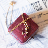 Collana con pendente in oro 18K con diamanti (0.06ctw ca.) e rubini, anni ‘70