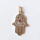Ciondolo “Mano di Fatima” vintage in oro 18K con rubino, anni ‘70