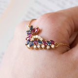 Vintage necklace in 18K gold with rubies, sapphires and diamonds (0.30ctw approx.), 1970s / 1980s