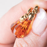 Orecchini vintage pendenti in oro giallo 18K con zaffiri arancioni, anni '70/'80