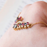 Vintage necklace in 18K gold with rubies, sapphires and diamonds (0.30ctw approx.), 1970s / 1980s