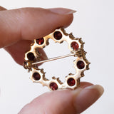 Spilla vintage in oro 8K con granati, anni ‘50/‘60