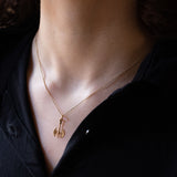 Coppia di ciondoli vintage a forma di asce bipenne in oro 14K, anni ‘80