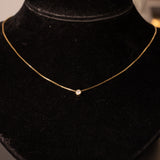 Collana vintage in oro 14K con punto luce di 0.10ct ca., anni ‘70/‘80