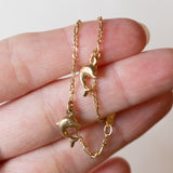 Braccialetto vintage in oro 18K con delfini, anni ‘80/‘90