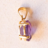 Lotto comprendente ciondolo in oro 18K con ametista, ciondolo in oro 18K a forma di “Uomo della Luna” in oro 18K e ciondolo in oro 9K a forma di elefantino