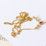 Collana vintage in oro 18K con rubino e diamanti (0.08ctw ca.), anni '70/'80