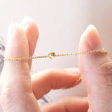 Braccialetto vintage in oro 18K con punto luce (0.05ct ca.), anni ‘70/‘80