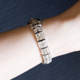 Bracciale semirigido vintage in oro bianco 18K con rubino naturale (0.90ct ca.) e diamanti (6.30ctw ca.), anni ‘60