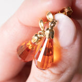 Orecchini vintage pendenti in oro giallo 18K con zaffiri arancioni, anni '70/'80