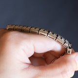 Bracciale semirigido vintage in oro bianco 18K con rubino naturale (0.90ct ca.) e diamanti (6.30ctw ca.), anni ‘60