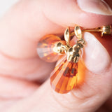 Orecchini vintage pendenti in oro giallo 18K con zaffiri arancioni, anni '70/'80