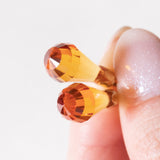 Orecchini vintage pendenti in oro giallo 18K con zaffiri arancioni, anni '70/'80