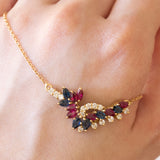 Vintage necklace in 18K gold with rubies, sapphires and diamonds (0.30ctw approx.), 1970s / 1980s