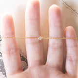 Braccialetto vintage in oro 18K con punto luce (0.05ct ca.), anni ‘70/‘80